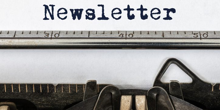 Vintage typewriter with word newsletter